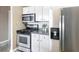 Efficient kitchen featuring stainless steel appliances and white cabinets at 115 W Peachtree Nw # 405, Atlanta, GA 30313