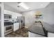 Well-lit kitchen featuring stainless appliances and bright white cabinets at 115 W Peachtree Nw # 405, Atlanta, GA 30313