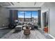 Bright living room featuring polished concrete floors, industrial ceilings, city views and modern, cozy furniture at 115 W Peachtree Nw # 405, Atlanta, GA 30313