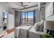 Comfortable main bedroom with natural light from the large window and exposed architectural details at 115 W Peachtree Nw # 405, Atlanta, GA 30313