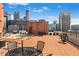 Expansive rooftop terrace offers city views and seating areas for relaxing and entertaining at 115 W Peachtree Nw # 405, Atlanta, GA 30313