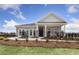 Charming brick home featuring a covered front porch, manicured lawn, and decorative fencing, offering a welcoming curb appeal at 1475 Park Lane Ln, Fairburn, GA 30213