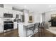 Modern kitchen featuring stainless steel appliances, white cabinets, a kitchen island with seating, and sleek countertops at 1475 Park Lane Ln, Fairburn, GA 30213