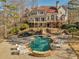 Extensive backyard with pool, patio, multi-level deck, and mature trees at 3460 Mansions Pkwy, Berkeley Lake, GA 30096