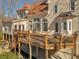 Backyard deck with dark railing offering views of the lush foliage at 3460 Mansions Pkwy, Berkeley Lake, GA 30096