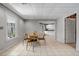 Bright dining area with tile floors and access to kitchen and back porch at 3460 Mansions Pkwy, Berkeley Lake, GA 30096