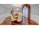 Formal dining room with hardwood floors, wainscoting, and decorative window treatment at 3460 Mansions Pkwy, Berkeley Lake, GA 30096