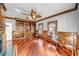 Bright living room features hardwood floors, built-in shelves, fireplace and a bay window at 3460 Mansions Pkwy, Berkeley Lake, GA 30096