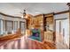 Living room with built-in shelves, hardwood floors, fireplace and a bay window with bench seating at 3460 Mansions Pkwy, Berkeley Lake, GA 30096