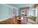 Relaxing living room with hardwood floors, light blue walls, and large windows at 3460 Mansions Pkwy, Berkeley Lake, GA 30096