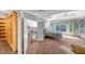 Main bedroom featuring tray ceiling, large window and ensuite bath at 3460 Mansions Pkwy, Berkeley Lake, GA 30096