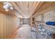 Interior view of a shed with shelving, windows and a plywood ceiling at 3460 Mansions Pkwy, Berkeley Lake, GA 30096