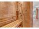 Walk-in shower featuring a built-in wooden bench and terracotta tile surround at 3460 Mansions Pkwy, Berkeley Lake, GA 30096