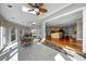 View of bright sunroom with tile floors, dining table and is open to kitchen area at 3460 Mansions Pkwy, Berkeley Lake, GA 30096