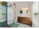 Modern bathroom with sleek fixtures, including a stylish shower with glass door and a double vanity at 633 Mckoy St, Decatur, GA 30030