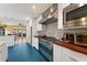 Modern kitchen featuring stainless steel appliances, hardwood countertops, and blue floors at 633 Mckoy St, Decatur, GA 30030