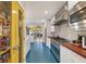 Modern kitchen with stainless steel appliances, yellow door and hardwood countertops at 633 Mckoy St, Decatur, GA 30030