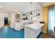 Modern kitchen featuring a stainless steel sink, floating shelves and blue floors at 633 Mckoy St, Decatur, GA 30030