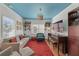 Stylish living room with hardwood floors, a piano, and blue ceiling at 633 Mckoy St, Decatur, GA 30030