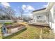 Landscaped side yard featuring raised garden beds and a charming porch with a calming blue ceiling at 633 Mckoy St, Decatur, GA 30030