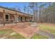 Exterior showcasing the brick porch and welcoming front entrance of the house at 6890 Cedar Mountain Rd, Douglasville, GA 30134