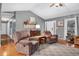 Inviting living room featuring vaulted ceilings, wood floors, and comfortable seating at 6890 Cedar Mountain Rd, Douglasville, GA 30134