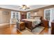 Warm and inviting main bedroom featuring hardwood floors and plenty of natural light at 6890 Cedar Mountain Rd, Douglasville, GA 30134