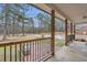 Inviting front porch featuring a wooded landscape view at 6890 Cedar Mountain Rd, Douglasville, GA 30134