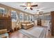 Relaxing sunroom filled with windows, ceiling fans and tile flooring, creating a bright and airy space at 6890 Cedar Mountain Rd, Douglasville, GA 30134