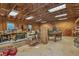 Spacious workshop featuring wood walls and ceiling, with ample lighting and storage, ideal for hobbies or projects at 6890 Cedar Mountain Rd, Douglasville, GA 30134