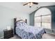 Charming bedroom with a large window, ceiling fan, and patterned bedspread at 1832 Millstone Mnr, Conyers, GA 30013