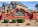 Brick monument sign with 'Millstone Manor' inscription, complemented by manicured landscaping at 1832 Millstone Mnr, Conyers, GA 30013