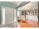 Welcoming foyer featuring hardwood floors, built-in bookshelves, and abundant natural light at 1832 Millstone Mnr, Conyers, GA 30013