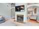 Inviting living room with modern fireplace, hardwood floors and open floor plan at 1832 Millstone Mnr, Conyers, GA 30013