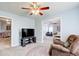 Comfortable living room with TV and view to the bedroom at 1832 Millstone Mnr, Conyers, GA 30013