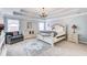 Spacious main bedroom featuring a decorative chandelier, crown molding, and sitting area at 1832 Millstone Mnr, Conyers, GA 30013