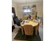 Bright dining area with a wood table, hutch, and carpet flooring at 3954 Riverside Pkwy, Decatur, GA 30034