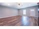 Large living room with modern ceiling fan, fresh paint, new floors, and updated trim at 411 Burke Cir, Mcdonough, GA 30253