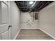 Basement storage room with updated floors and exposed ceiling at 4159 King Valley Se Dr, Smyrna, GA 30082