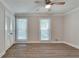 Bedroom with two windows, wood-look flooring and ample closet space at 4159 King Valley Se Dr, Smyrna, GA 30082