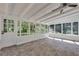 Bright sunroom with white brick walls, lots of windows and tile flooring at 4159 King Valley Se Dr, Smyrna, GA 30082