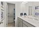 Bright bathroom features a double sink vanity with white countertop and gray cabinetry at 640 Blackshear Trl, Temple, GA 30179