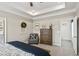 Calming main bedroom with a tray ceiling, carpeted floors, an accent chair, and a decorative dresser at 640 Blackshear Trl, Temple, GA 30179