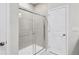 Bathroom featuring a glass enclosed shower and a tile surround at 159 Park Lane, Fairburn, GA 30213