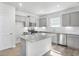 Modern kitchen with granite island, stainless steel appliances, and white cabinets at 159 Park Lane, Fairburn, GA 30213