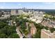 Overhead view capturing Slaton Manor condos nestled among trees with the city skyline in the background at 2965 Pharr Court South Nw # 712, Atlanta, GA 30305