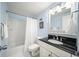 Bathroom with a shower and tub combination, updated fixtures, and a vanity with ample counter space at 2965 Pharr Court South Nw # 712, Atlanta, GA 30305