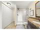 Bright bathroom with updated features, including a walk-in shower, granite countertop, and closet at 2965 Pharr Court South Nw # 712, Atlanta, GA 30305