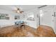 Dining area with hardwood floors, a glass table, modern chairs, and a view of the kitchen at 2965 Pharr Court South Nw # 712, Atlanta, GA 30305