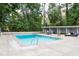 Community pool area with lounging area and ample outdoor seating, perfect for relaxing and enjoying the community at 2965 Pharr Court South Nw # 712, Atlanta, GA 30305